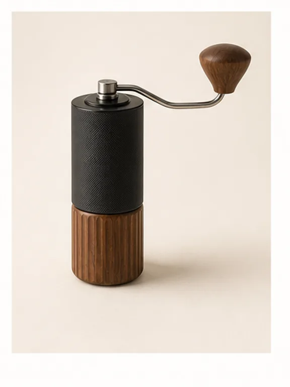 Slim manual coffee grinder held above a canvas bag